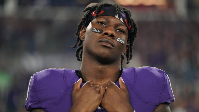 Marquise Brown stands during the national anthem prior to an NFL game.