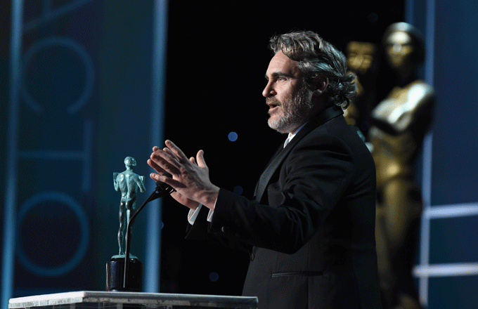 Joaquin Phoenix accepts his SAG Award.