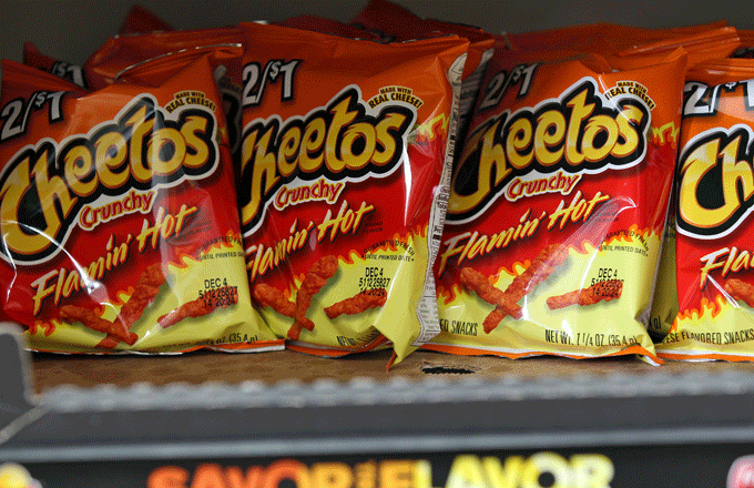 Bags of Flamin&#x27; Hot Cheetos sit on store shelves.
