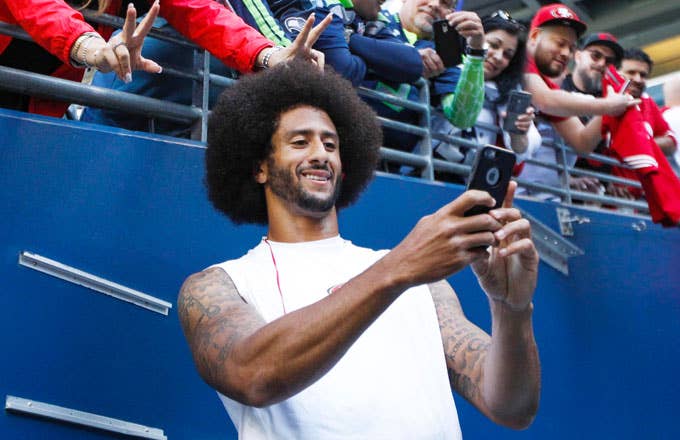 Colin Kaepernick takes a selfie with a 49ers fan.