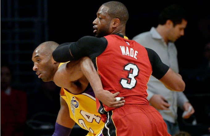 Kobe Bryant #24 of the Los Angeles Lakers is defended by Dwyane Wade