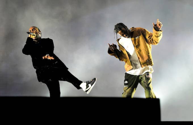 Rappers Kendrick Lamar (L) and Travis Scott.