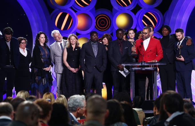Jordan Peele with cast/crew accepts Best Feature for 'Get Out' onstage.