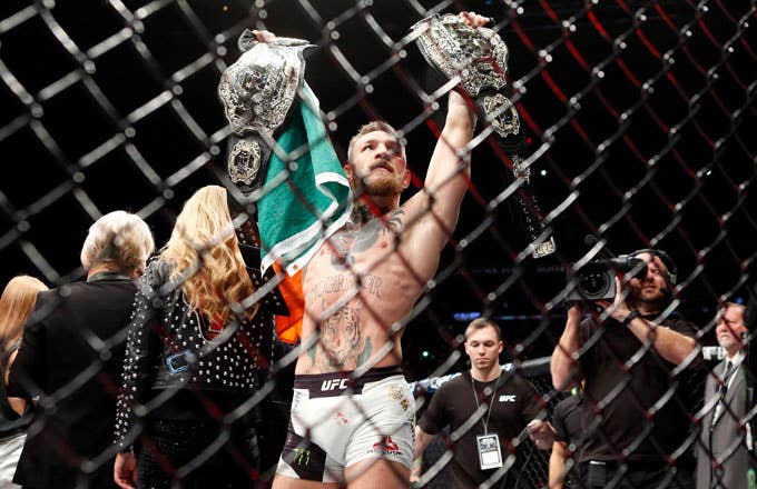 Conor McGregor celebrates winning the lightweight title over Eddie Alvarez.