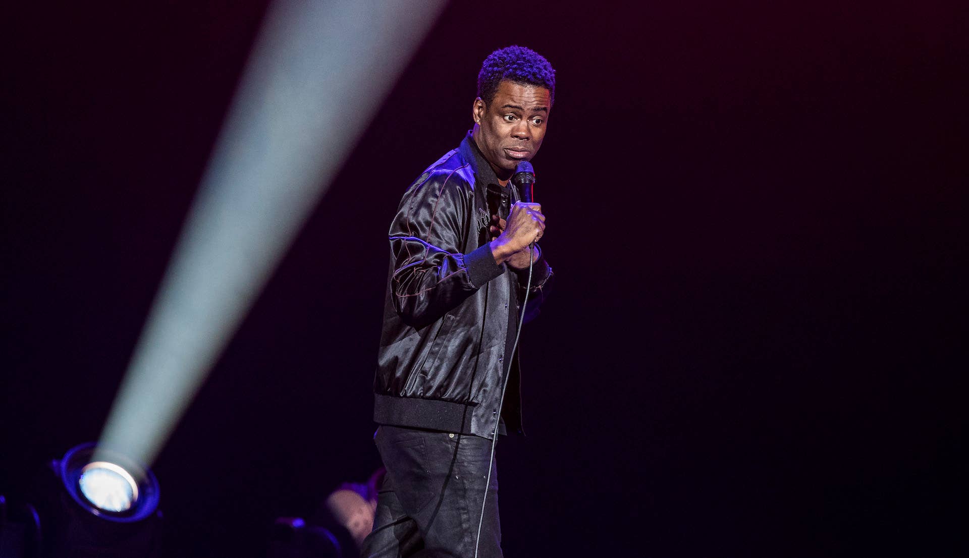 Chris Rock onstage with microphone
