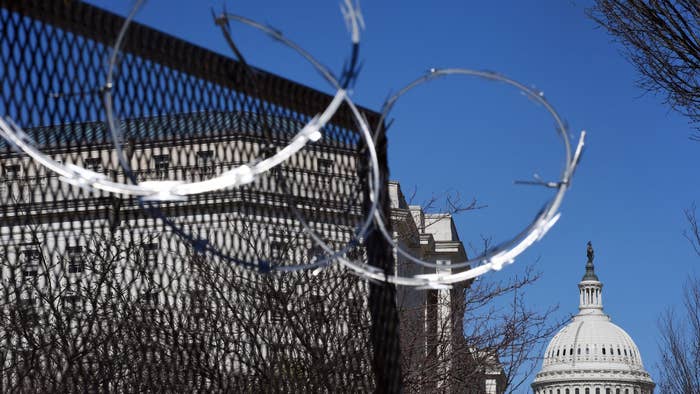 Razor wire is seen on fencing near the US Capitol Building on Capitol Hill