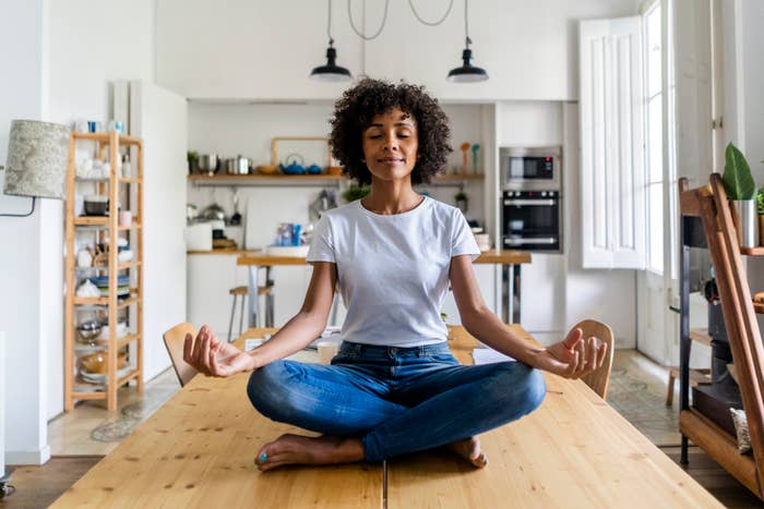 Woman meditating at home