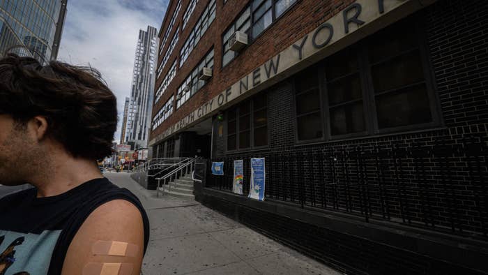 A man, who wished to remain anonymous, displays his arm where he received a polio vaccination