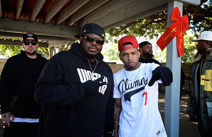Lee 'Q' Odenat and recording artist Kid Ink attend WorldStarHipHop's 3rd Annual Skid Row Xmas