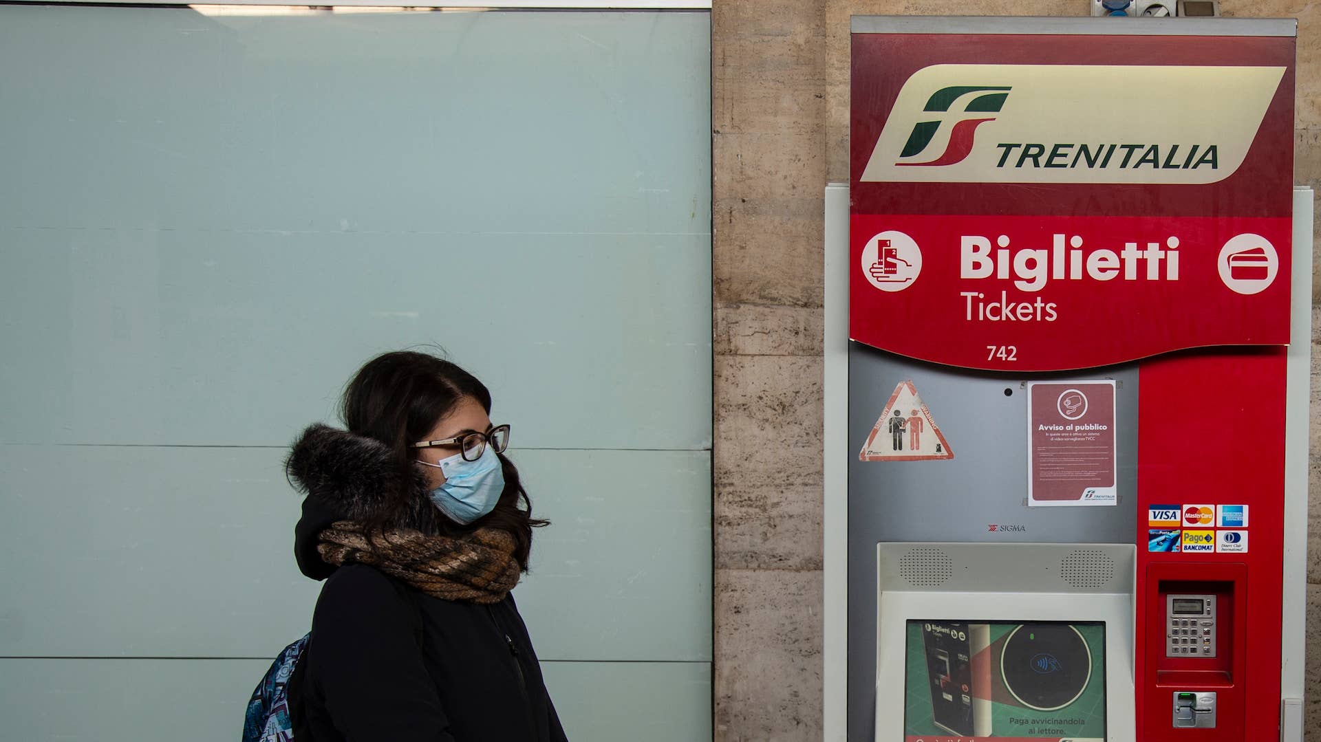 Train passenger with masks during sanitary checks on March 08, 2020