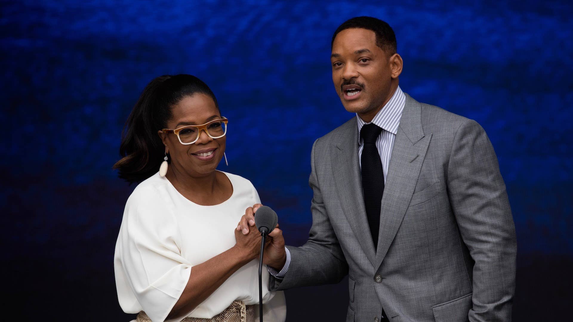 Entertainers Oprah Winfrey and Will Smith speak at the opening of the National Museum of African American History and Culture