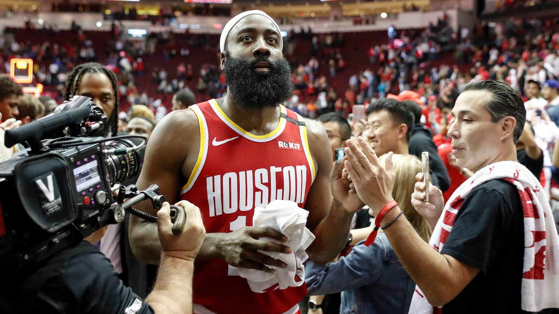 James Harden #13 of the Houston Rockets greets fans on the way to the locker room