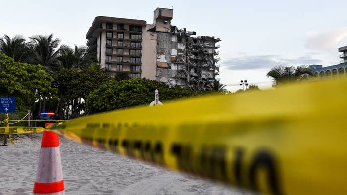 Police tape blocks access to a partially collapsed building in Surfside north of Miami Beach.