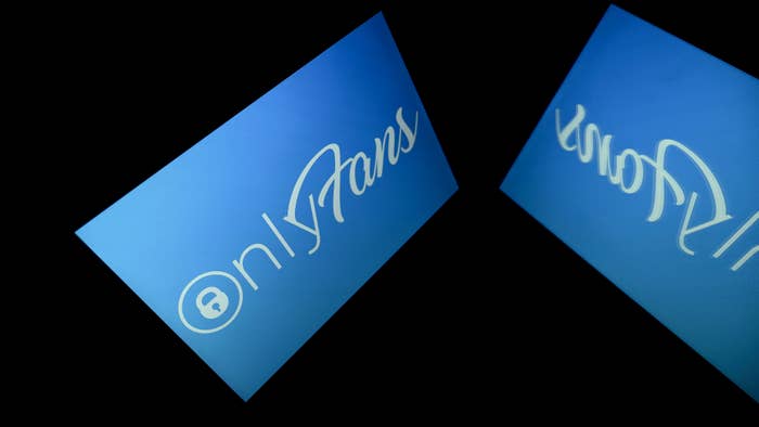 A picture taken on October 5, 2021 in Toulouse shows the logo of Onlyfans social media displayed by a tablet.
