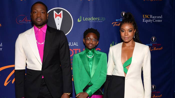 This is an image of Dwyane Wade, Zaya Wade, and Gabrielle Union-Wade