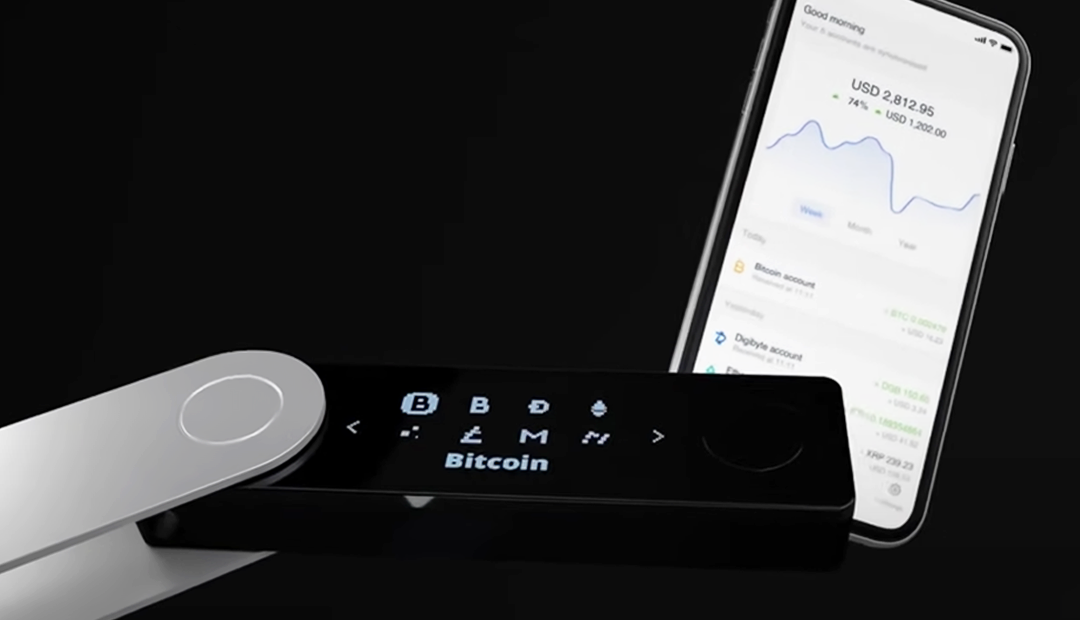 Ledger X Nanco crypto wallet wirelessly connecting to smart phone to view crypto stocks.