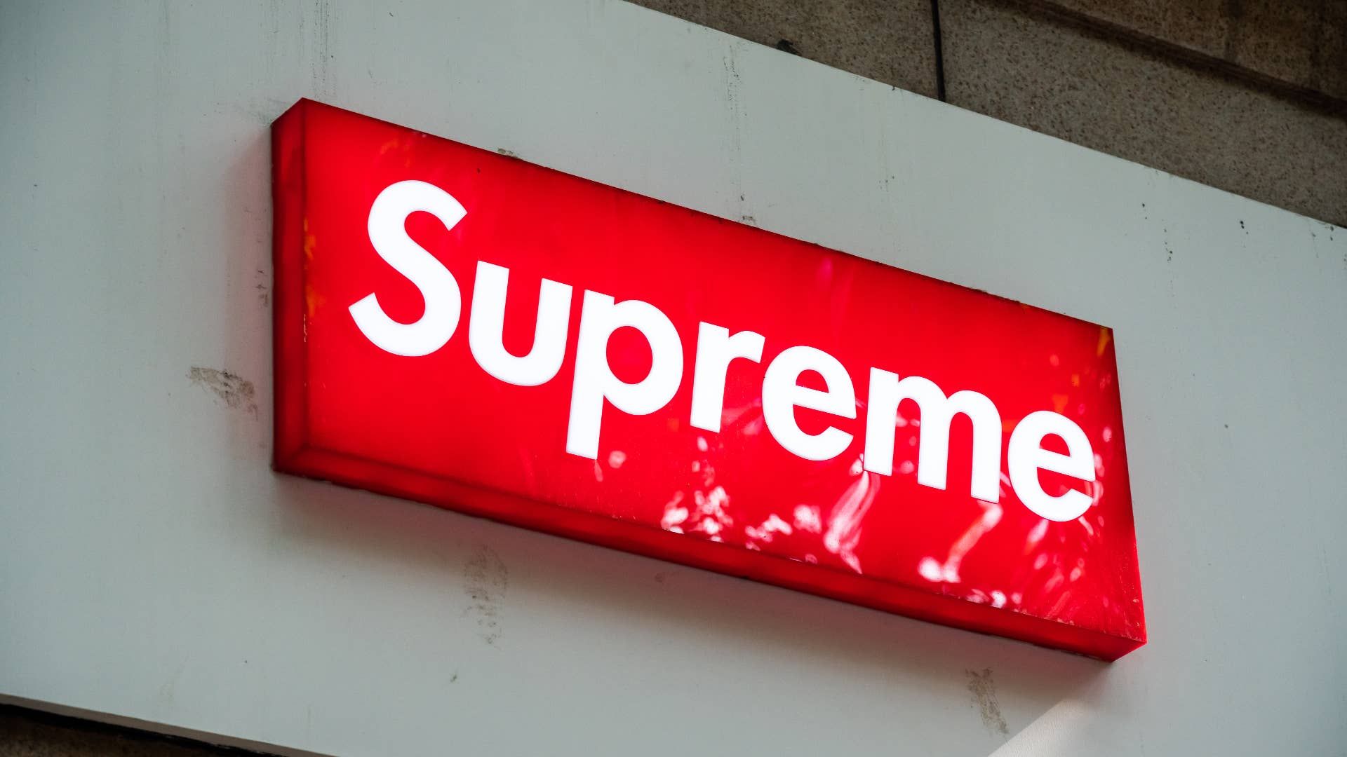A logo for the brand Supreme is shown