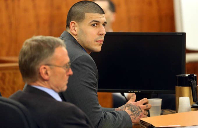 Aaron Hernandez sits in a courtroom.