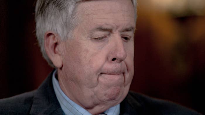 Gov. Mike Parson listens to a media question during a press conference.