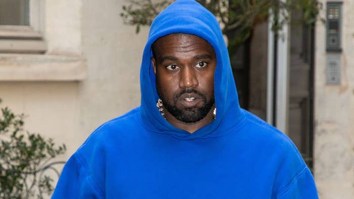 Kanye West spotted in blue hoodie