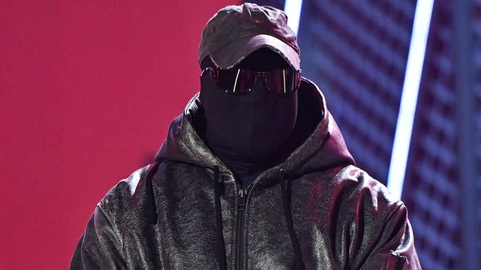 Ye is seen wearing a hat and a mask at a BET event