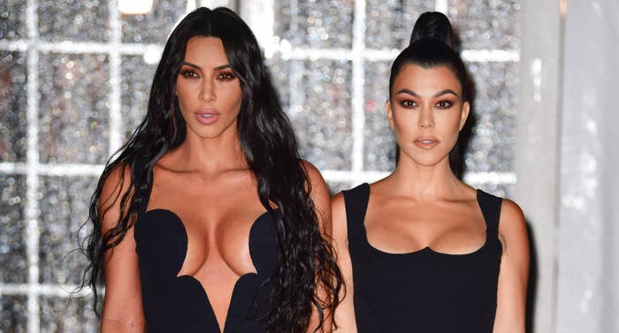 Kim and Kourtney Kardashian posing together