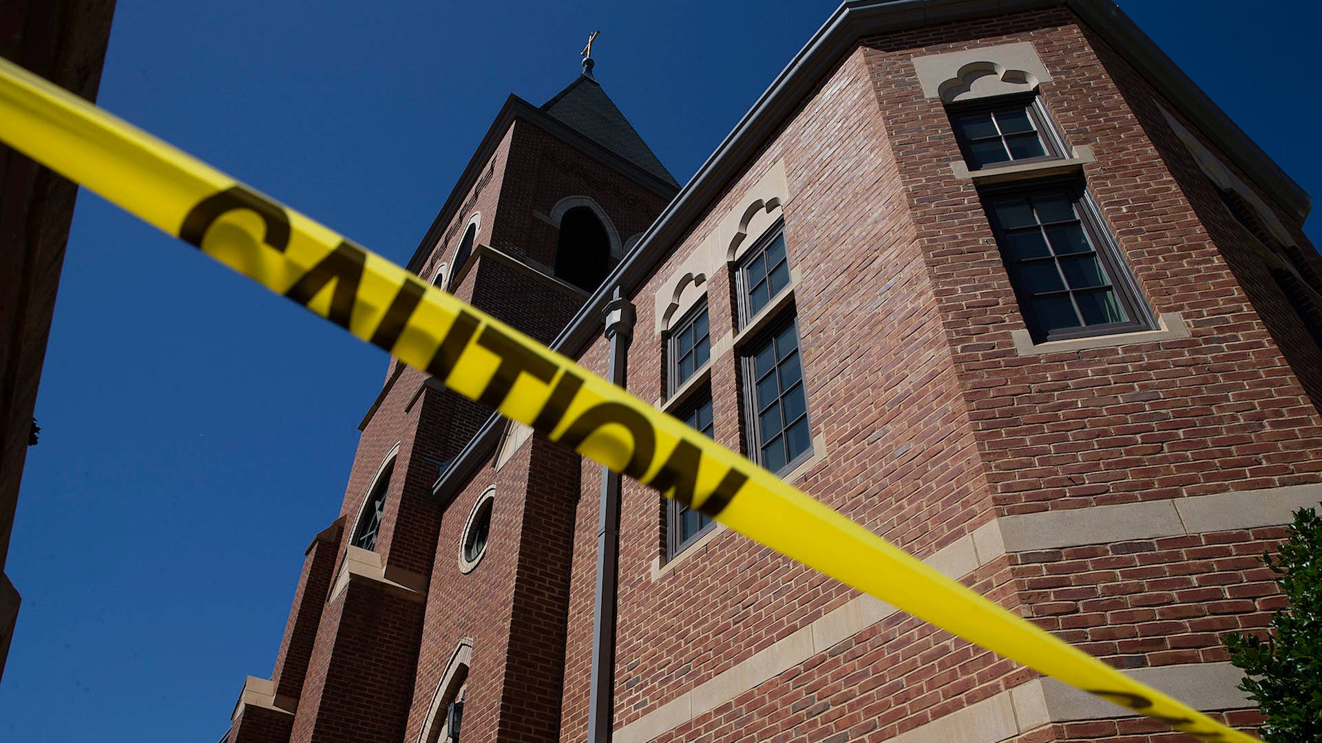 Caution tape in front of the Sacred Heart Church