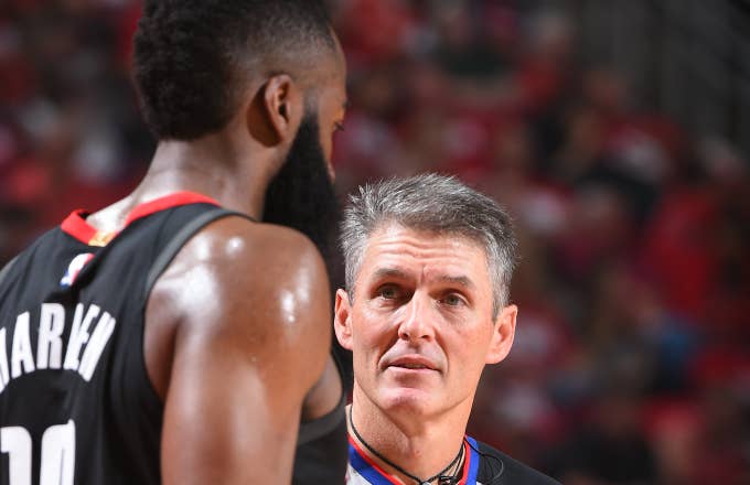 NBA referee Scott Foster talks with James Harden