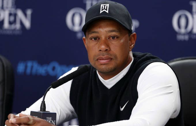 Tiger Woods answers questions at a press conference.