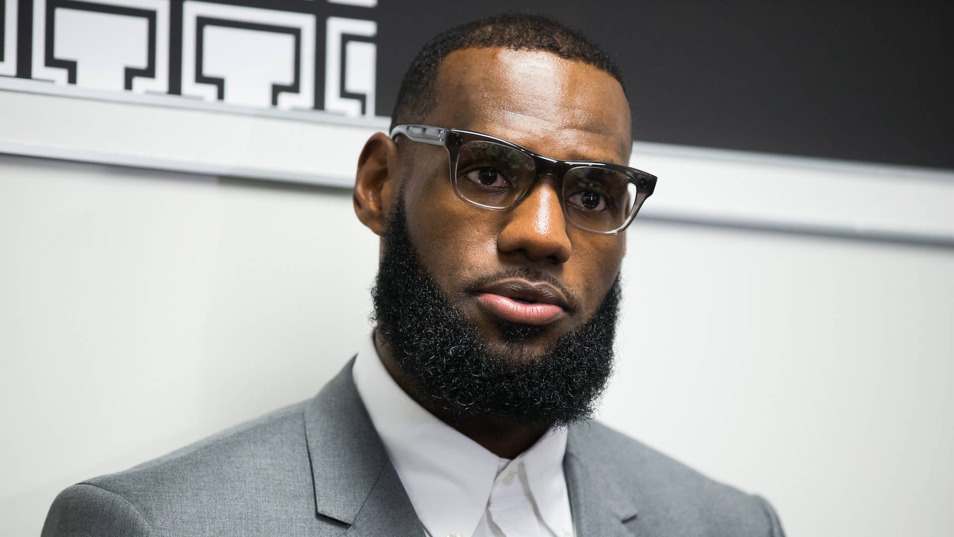 LeBron James addresses media following the grand opening of I Promise school.