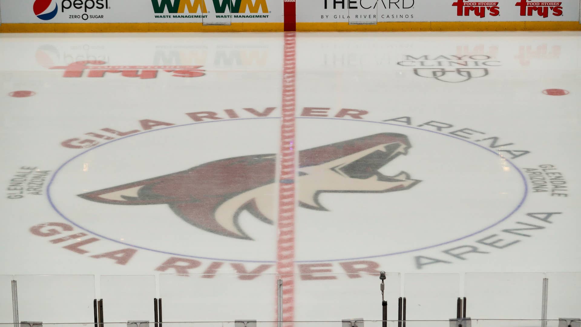 The Coyotes logo on the ice during the NHL hockey game against the Chicago Blackhawks.