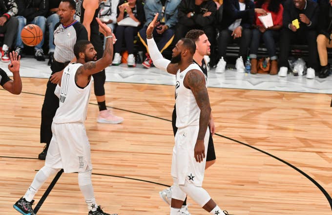 LeBron James #23 and Kyrie Irving #11 of Team LeBron give each other high fives