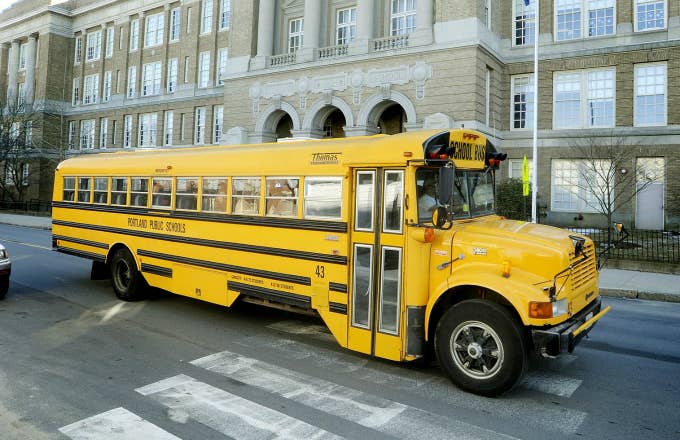 A school bus passes by Portland High School