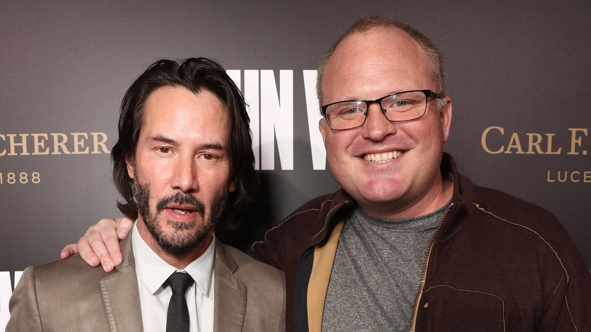 Keanu Reeves and Derek Kolstad attend the Premiere Of "John Wick: Chapter Two.'