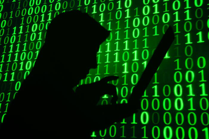 Computer hacker in front of screen