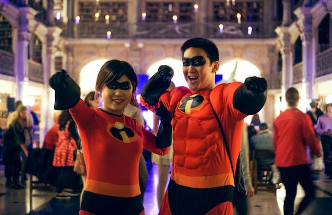 Two college students, a male and female in a couple, pose as The Incredibles.