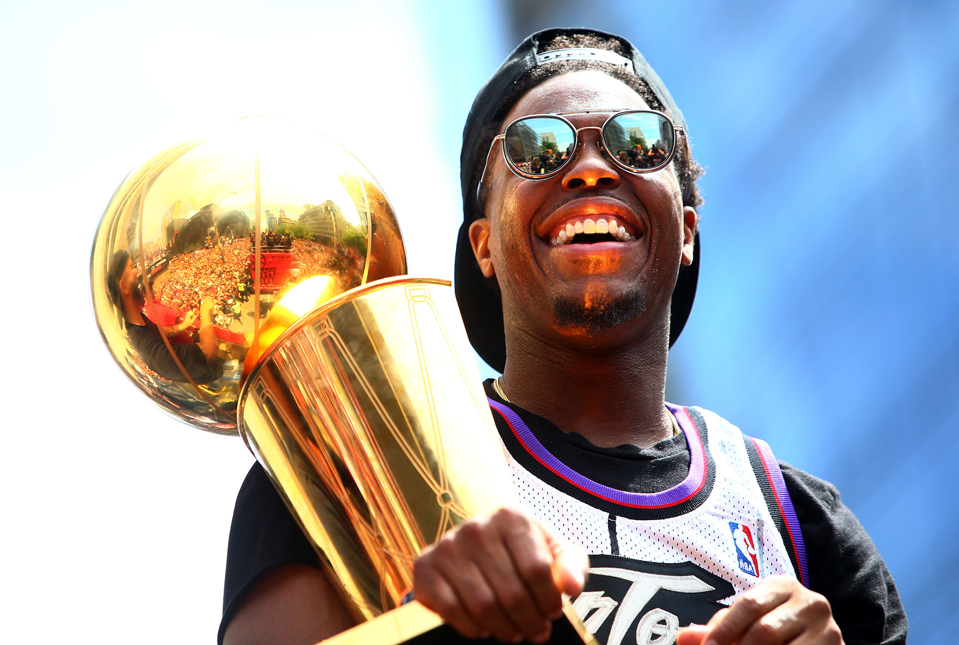 Kyle Lowry #7 of the Toronto Raptors holds the championship trophy during the Toronto Raptors Victory Parade