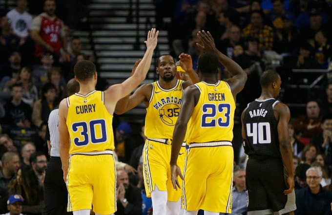 Kevin Durant #35 of the Golden State Warriors celebrates with teammates