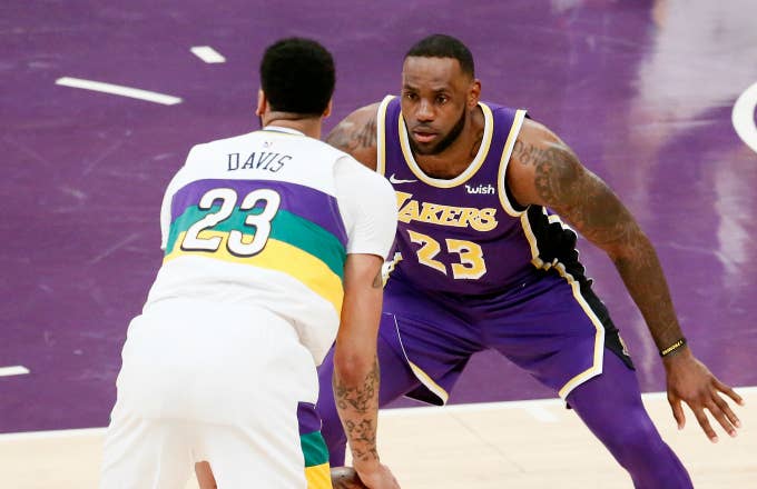 LeBron James #23 of the Los Angeles Lakers plays defense against Anthony Davis