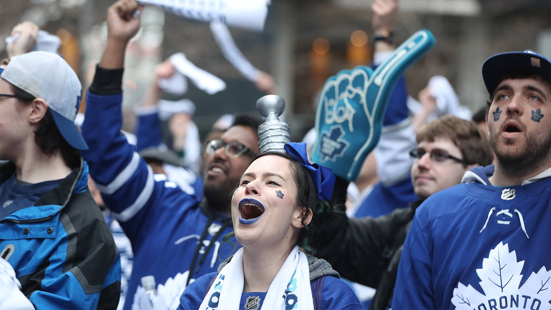 Maple Leafs fans cheer outside in Jurassic Park and Maple Leaf Square