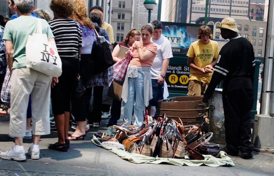 Vendors selling imitation designer bags on Canal Street in New York City.  Part 2 
