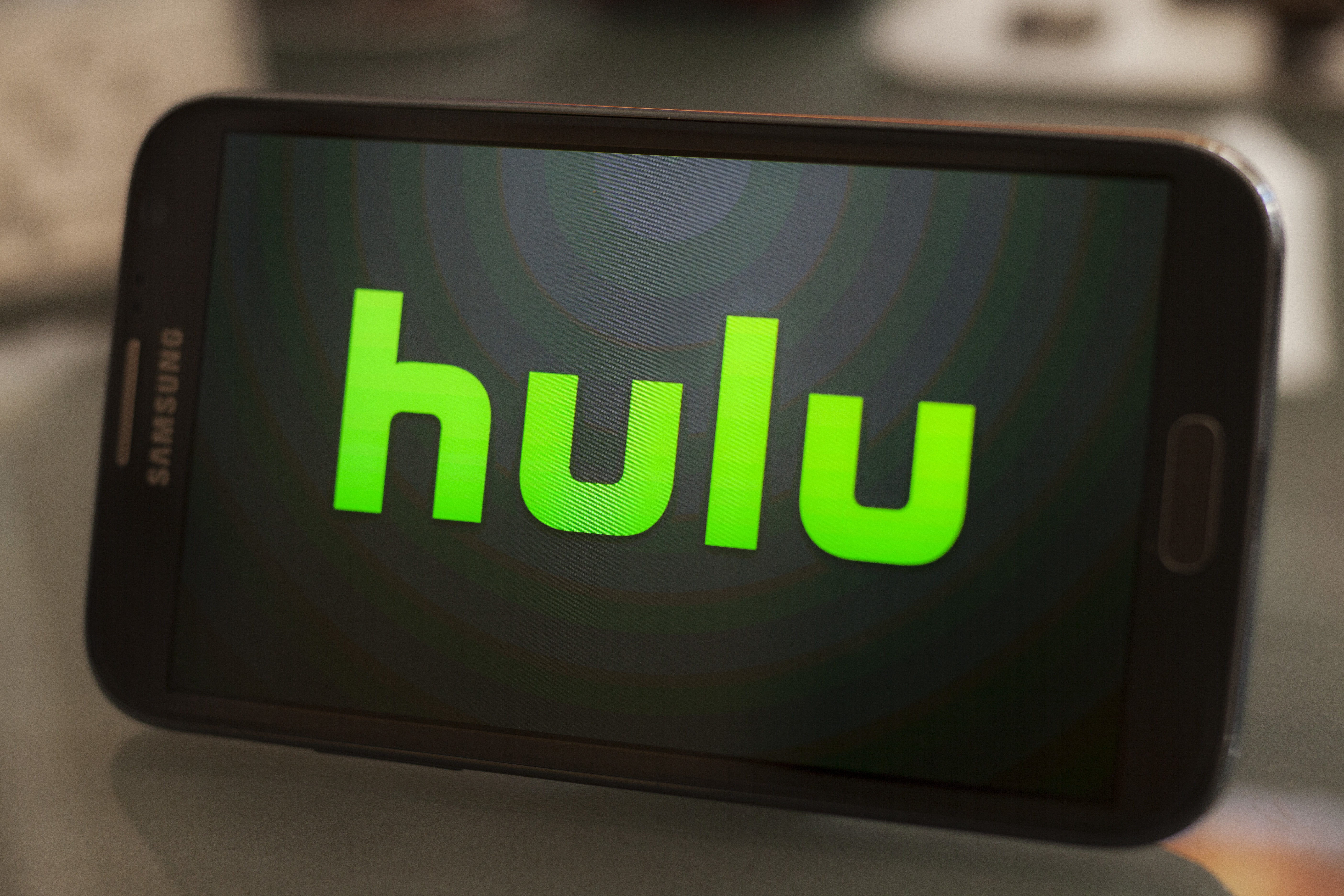 The Hulu logo on a smartphone