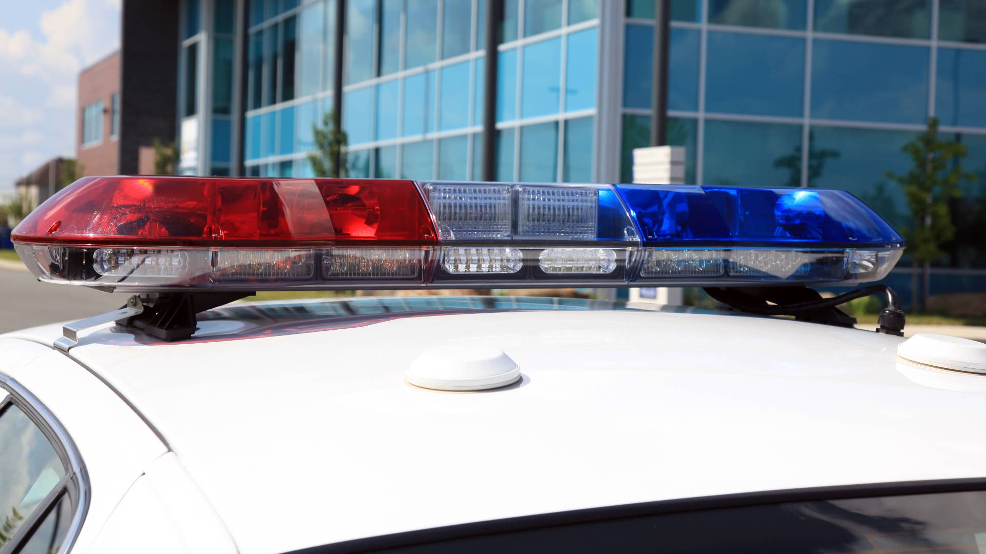 A police car is seen on a street during the day