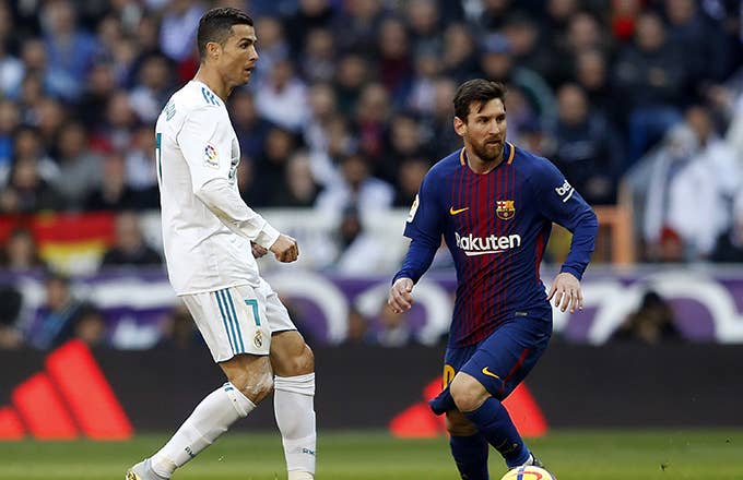 Lionel messi and cristiano ronaldo in a playful moment