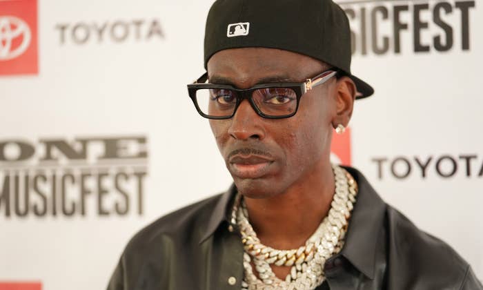 young dolph on a red carpet in glasses