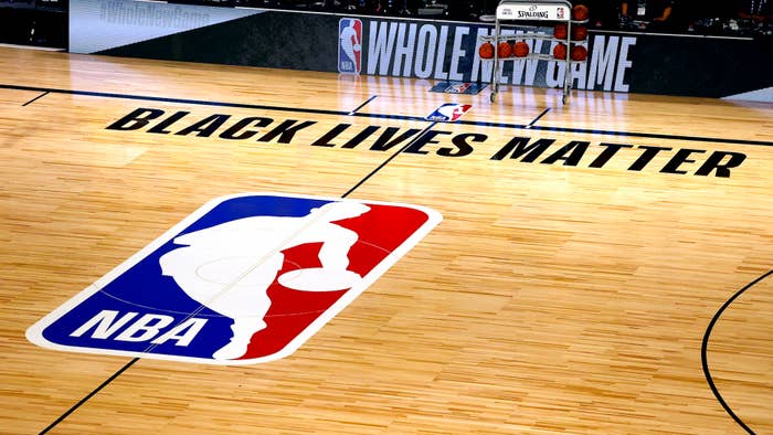 An overview of the basketball court shows the NBA logo and Black Lives Matter.