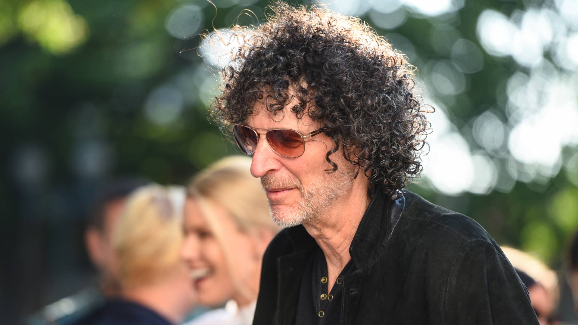 Howard Stern is pictured wearing tinted glasses