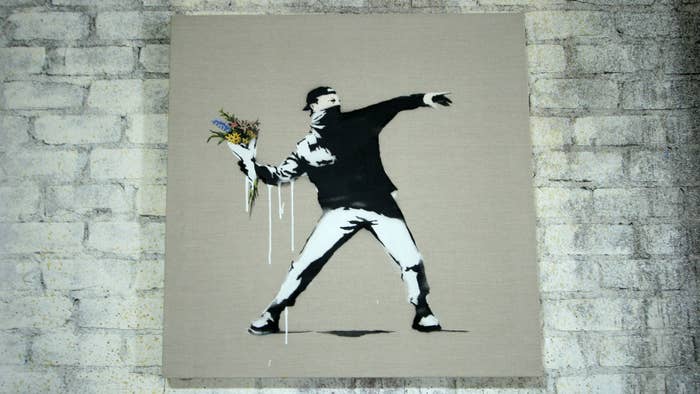 Photograph of Banky iconic graffiti man with flowers