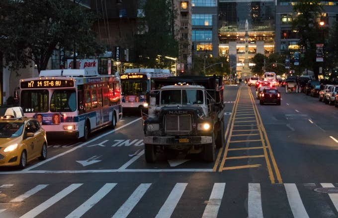 Historic district: traffic at dawn, truck and public buses rushing to their destination