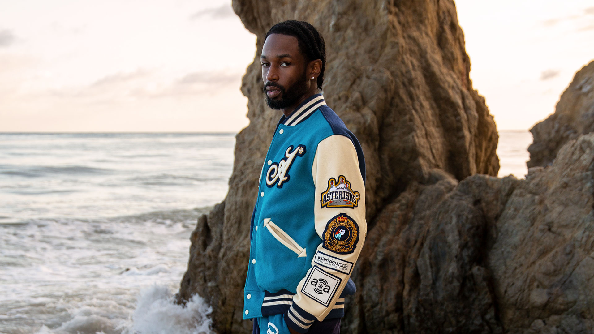 Jazz Cartier in Adidem Asterisks x Roots jacket